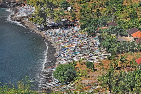 Forested east coast with outrigger boats near Amed, Bali, Indonesia, Asia