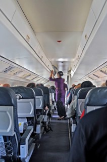 Flight attendant, obsolete stewardess, propeller aircraft, jet-prop Fokker 50, former Riau