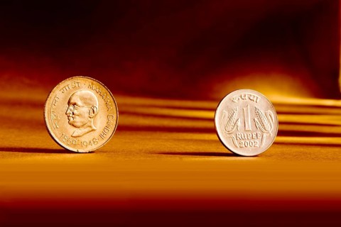 Double pair Indian currency one rupees coin front side and backside manner embossed Mahatma Gandhi