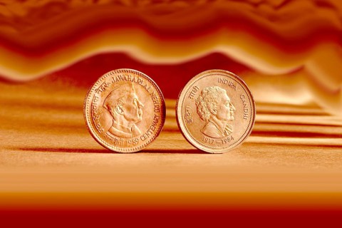 Double pair Indian currency five rupees coin and artistic background backside embossed Jawaharlal
