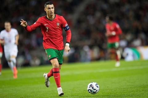 Football match, captain Cristiano RONALDO CR7 Portugal on the ball, captain's armband, left arm