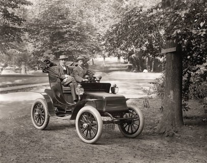 Thomas Alva Edison and William Billy Bee in Detroit Electric automobile on Edge Hill Avenue in