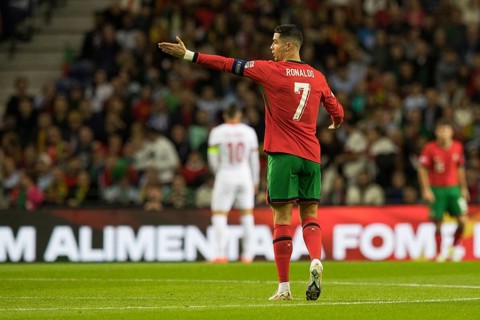 Football match, captain Cristiano RONALDO CR7 Portugal walking to the left with his arm pointing to