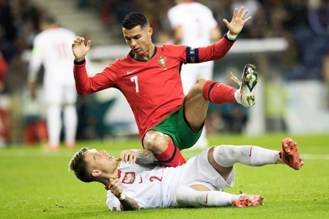 Football match, captain Cristiano RONALDO CR7 Portugal on the stomach of Kamil PIATKOWSKI Poland