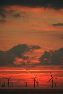 Sky over Baltic Sea wind farm at sunset