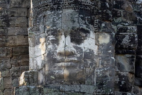 Giant stone-carved face of the Bodhisattva Lokeshvara, also known as Avalokiteshvara, Bayon Temple,