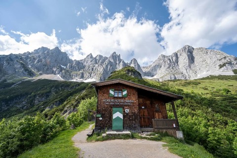 Mountain hut Ackerlhütte, rocky mountain peaks behind, Wilder Kaiser, Kaiser Mountains, Tyrol,