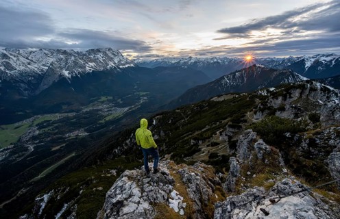 View Mountain panorama with Wetterstein mountains and Zugspitze, at sunset with sun star,