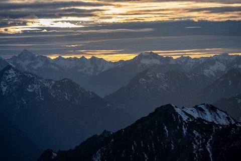 Mountain panorama with snow at sunset, in autumn, view from Kramerspitz, Bavarian Prealps, Bavaria,