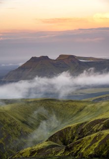 Fog between mountains, moss-covered volcanic mountain landscape, at sunset, Pakgil, Iceland, Europe