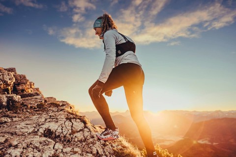 Trail running in autumn on the Jochberg on Lake Walchensee against the wonderful backdrop of the