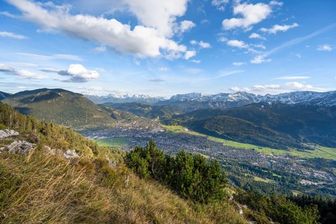 View of Garmisch-Partenkirchen and mountain panorama, hike to Kramerspitz, in autumn, Ammergau