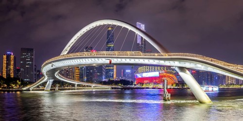 Guangzhou skyline with Haixin Bridge across the Pearl River skyscrapers panorama at night in
