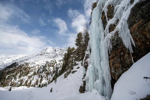 Ice waterfall, icy waterfall on a rock, snow-covered mountain landscape, Ortler Alps, Vinschgau