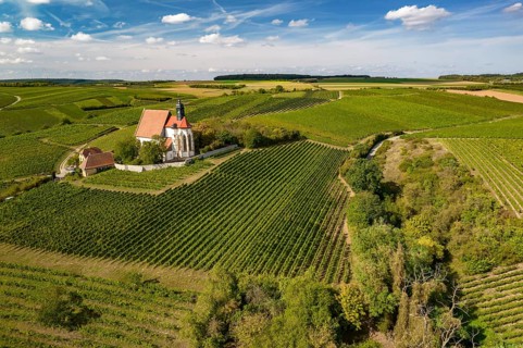 The pilgrimage church Maria im Weingarten and vineyards near Volkach seen from the air, Lower