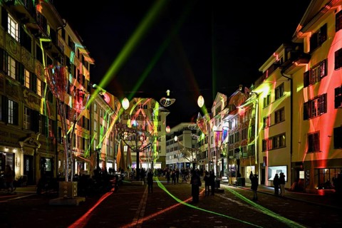 Light installation, on building facades and sculptures in the form of glasses and butterflies in