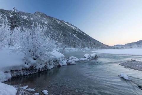Isar valley in winter at temperatures of minus 18 degrees Celsius. Snow covered landscape with the