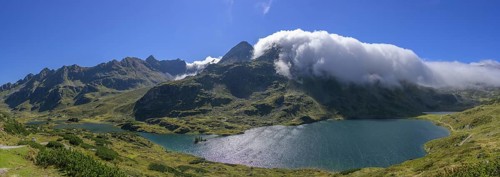Lower Giglachsee with fog over the mountain ridge, Schladming, Styria, Austria, Europe