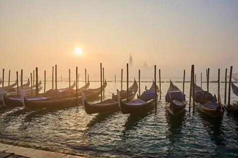 View from 'Colonna di San Marco e San Teodoro' on the gondolas lying in the water with the church