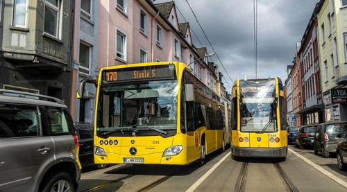 Tram and bus in traffic, on the street Schonnebeckhöfe in Essen-Katernberg, North Rhine-Westphalia,
