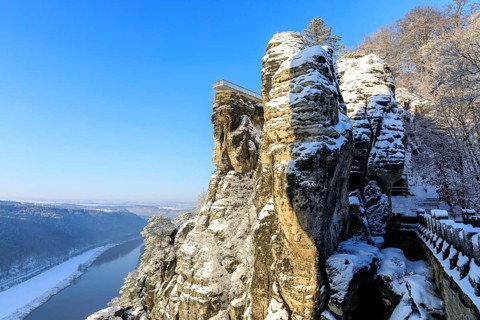 View from the Bastei Bridge into the Elbe Valley and to the floating viewing platform of the Bastei