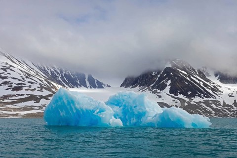 Iceberg melting in summer in Magdalenefjorden, fjord in Albert I Land on Svalbard, Spitsbergen,