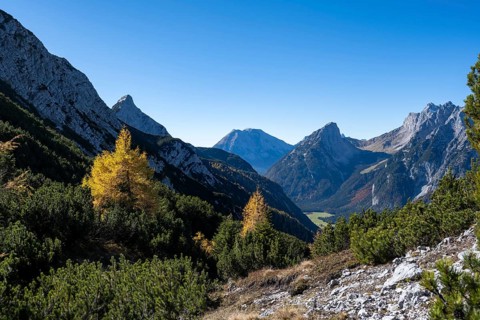 Mountain landscape in autumn, view of the Leutasch valley with mountain peak of the Wetterstein