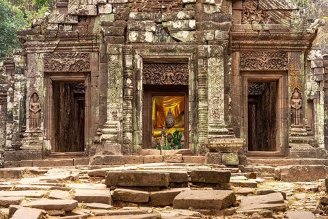 Modern Buddha statues in the central sanctuary of the mountain temple Wat Phu, Champasak province,