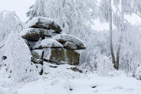 Rock formation with hoarfrost and snow on the summit of the Czorneboh, Lusatian Mountains, Upper
