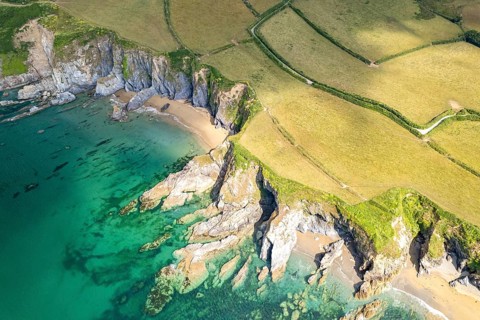 Hemmick Beach and the coast of St Austell seen from the air, Cornwall, England, United Kingdom,