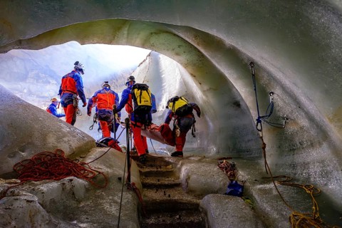 Cave rescuers from the Bavarian Mountain Rescue Service rescue an injured man from the Schellenberg