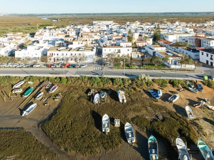 The fishing village of Isla del Moral and its surrounding marsland at low tide. Aerial view. Drone