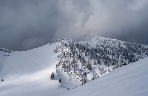 Mountain landscape in the snow, mountain peaks Tanzeck and Aiplspitz, dramatic clouds,
