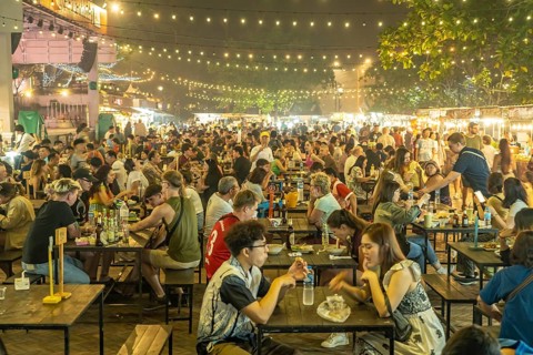 Crowded dining tables at the night market in Luang Prabang, Laos, Asia