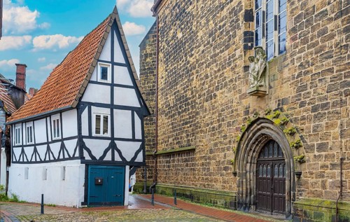 Wind hole narrow house next to Martinikirche Minden Germany