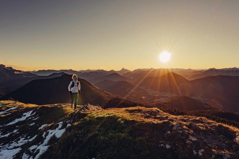 Trail running in autumn on the Jochberg on Lake Walchensee against the wonderful backdrop of the