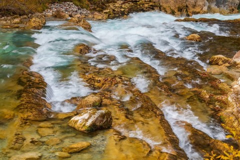 The Riss creek flowing through an autumnal landscape in the Eng valley