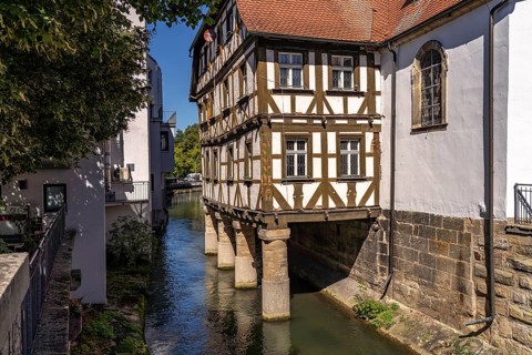 Half-timbered hospital building on piles in the water, Forchheim, Upper Franconia, Bavaria,