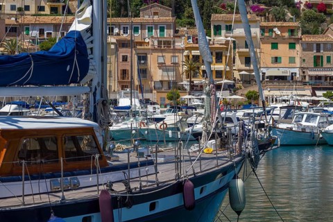 Sailing boats in the harbour of a sunny Mediterranean village, Port de Sóller, Majorca, Balearic