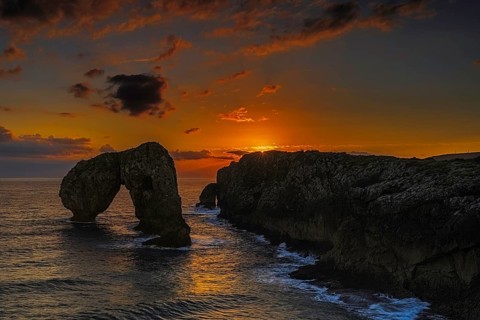 Impressive sunrise on the beach of Castro de las Gaviotas, Huelga-Asturias, Spain, Europe