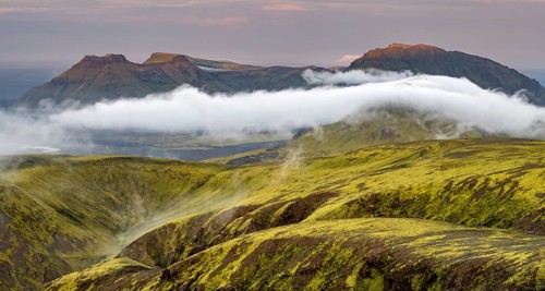 Fog between mountains, moss-covered volcanic mountain landscape, at sunset, Pakgil, Iceland, Europe