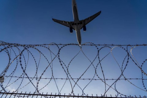 Symbolic image security at the airport, outer fence at Düsseldorf International Airport, steel wire