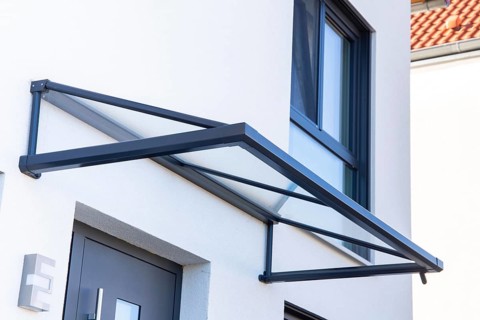 Aluminium and glass canopy at the entrance area of a residential building