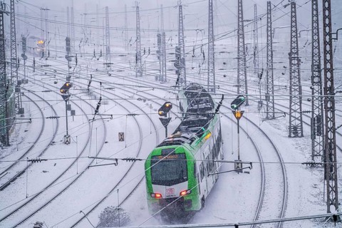 Winter weather, heavy snowfall, railway tracks in front of Essen main station, S-Bahn train, North