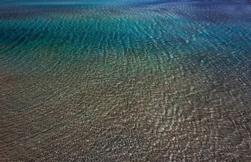 Drone shot, glittering water surface on the beach of Elafonisi, west coast, Crete, Greece, Europe