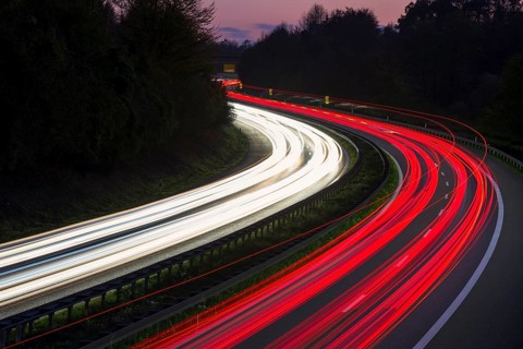 Light traces of cars on a motorway at night in a bend, Winnenden, Baden-Württemberg, Germany,