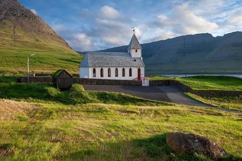 White church with mountains and green fields, Vidareidi, Vidoy Island, Viðareiði, Viðoy Island,