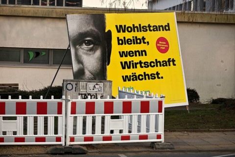 Large FDP election poster with Christian Lindner for the 2025 Bundestag election behind a barrier,