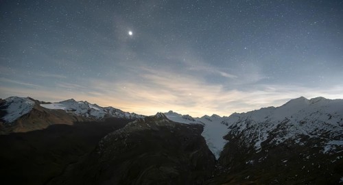 Starry sky with moon, mountain panorama and glacier, in autumn with snow, view of Gurgler Ferner