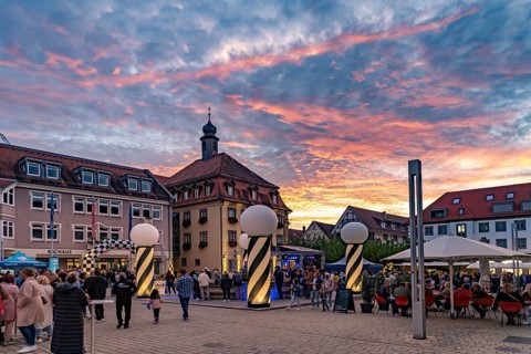 Sunset at the market square during the Shopping Lights event in Neckarsulm, Baden-Württemberg,